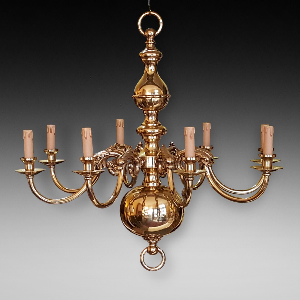 A large brass eight branch chandelier