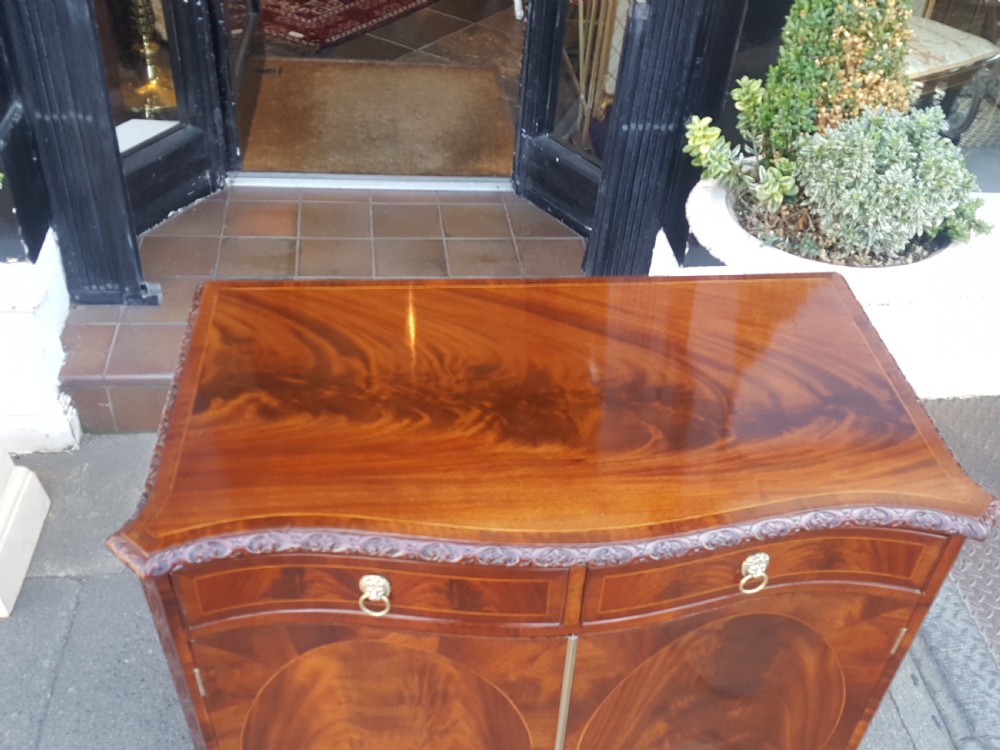 George III style serpentine mahogany drinks cabinet View II