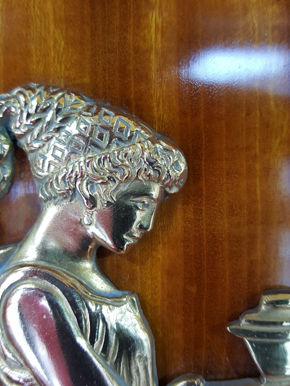 A tall late 19th-century Swiss satinwood salon cabinet featuring a pediment top, gilded metal mounts, glazed display compartments, central mirror, and inlaid door panels. View VI