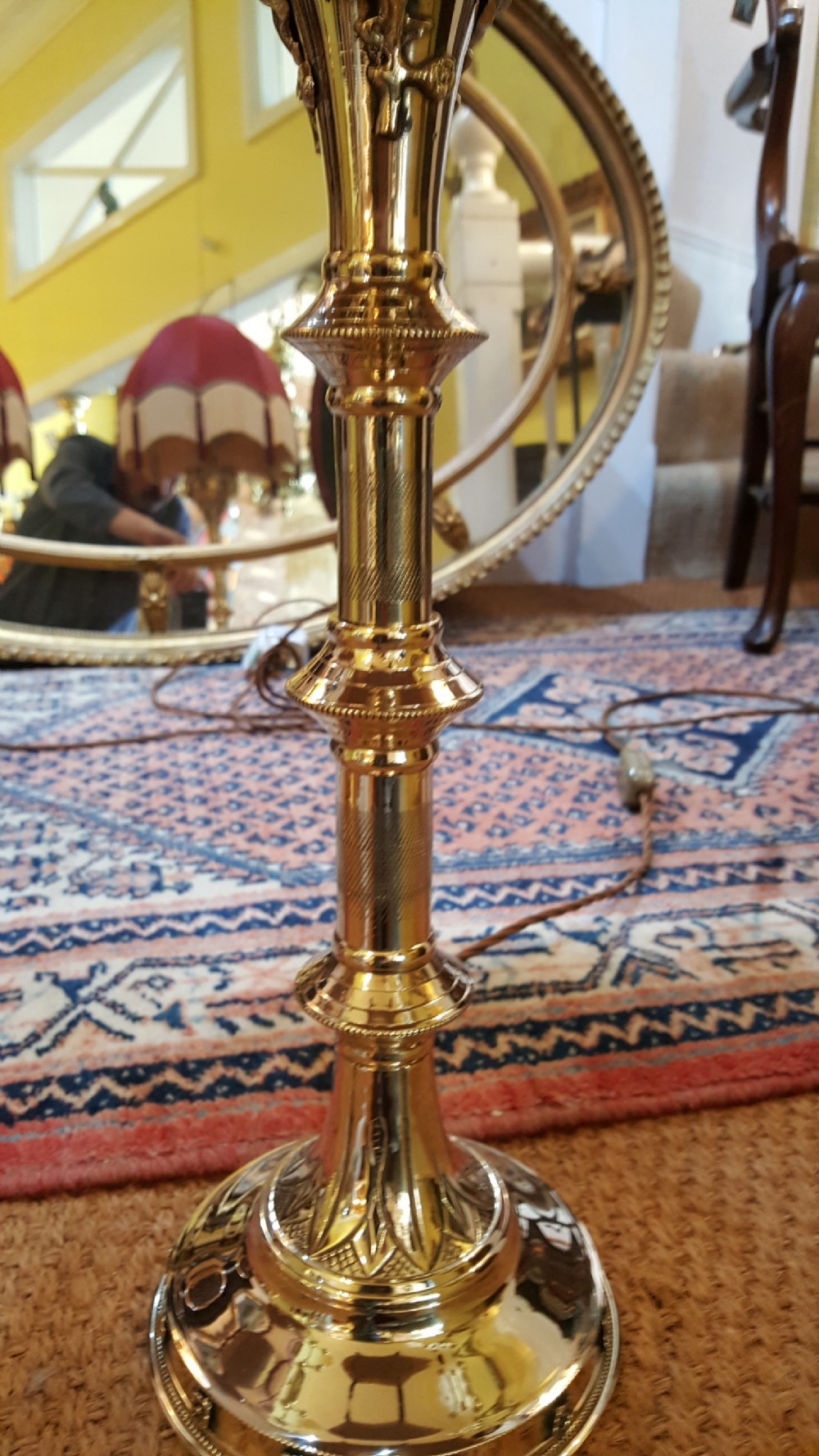 A pair of early 20thC brass candlesticks View III