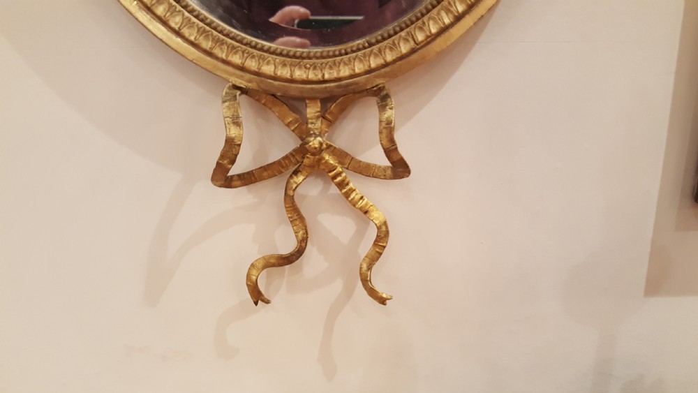Pair of Edwardian Adam Revival carved gilt wood and gesso wall mirrors View III