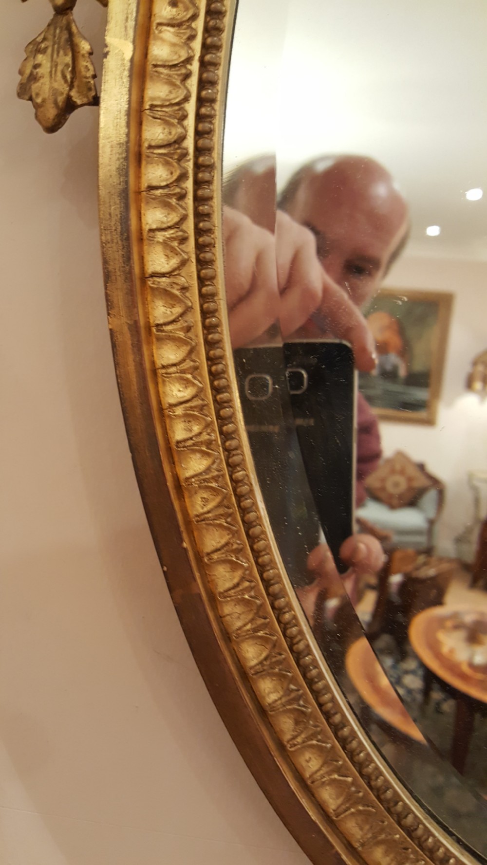 Pair of Edwardian Adam Revival carved gilt wood and gesso wall mirrors View IV