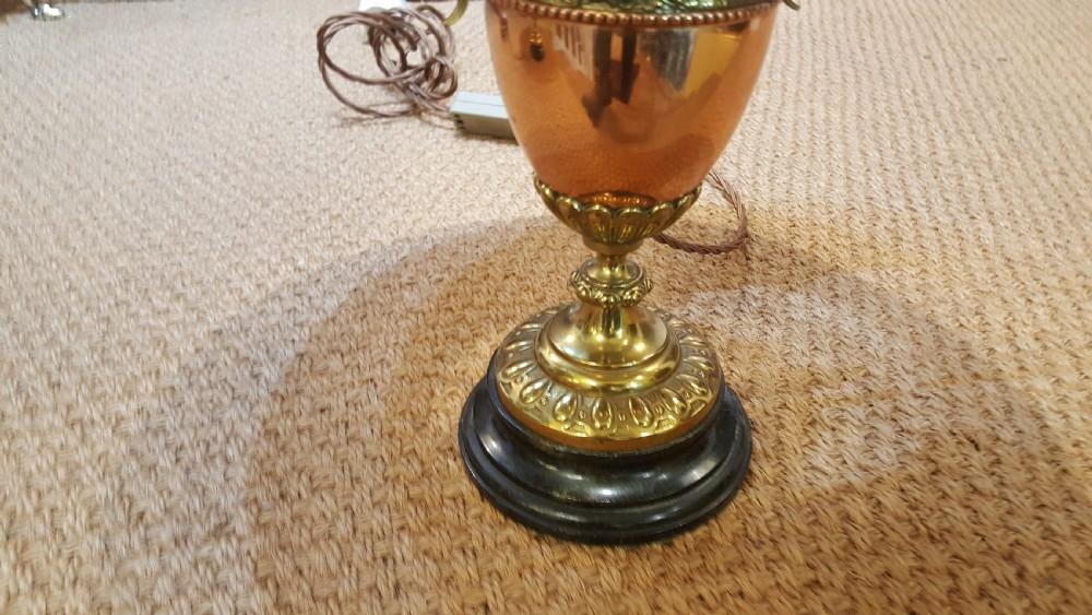 A pair of late 19th-century table lamps with urn-shaped copper and brass bases paired with blue tweed shades. View IV
