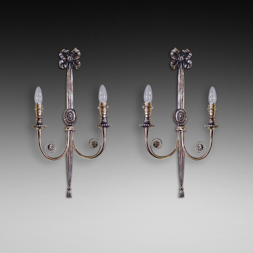 Pair of gilt brass two-branch wall lights