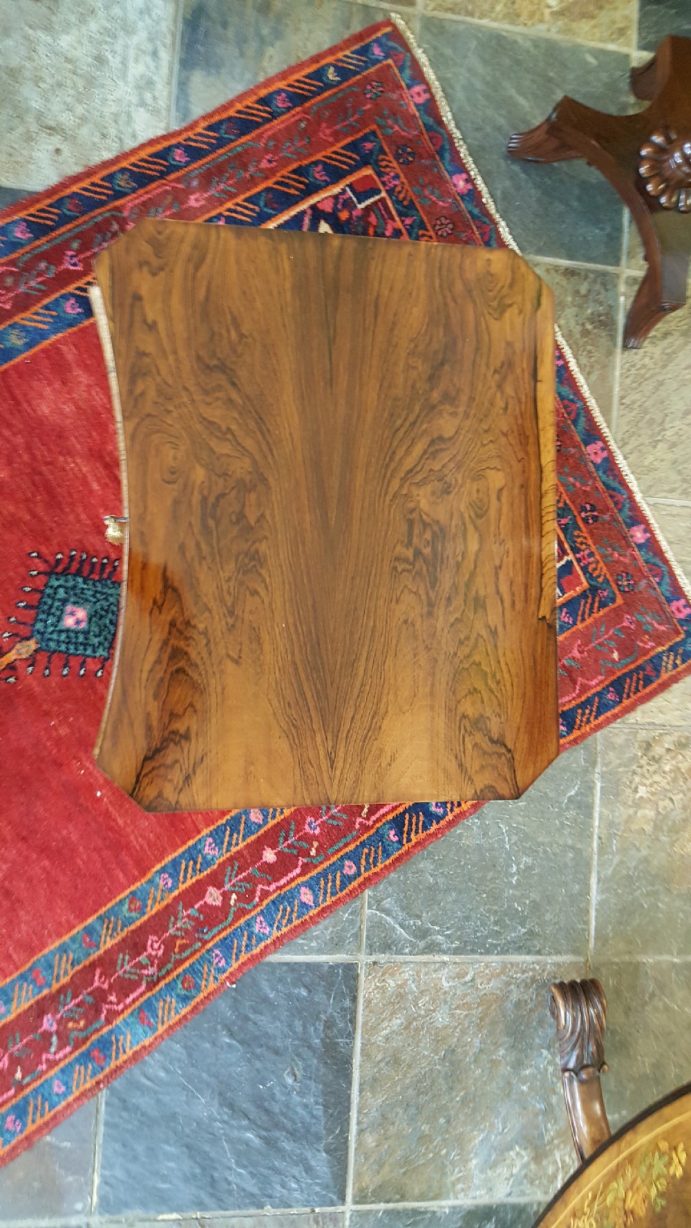 A mid-19th-century dark rosewood sewing table featuring curved cabriole legs, an X-shaped stretcher, and a fabric-covered storage basket underneath. View II