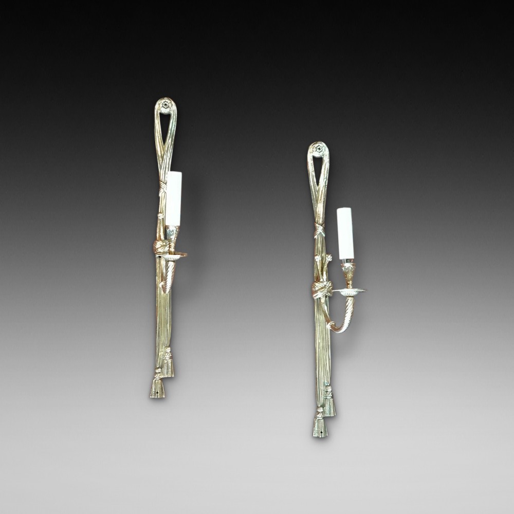 Pair of early 20thC gilt metal single branch wall lights