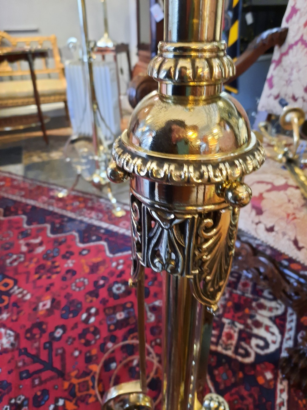 A late Victorian telescopic brass standard lamp featuring tripod scroll feet and a domed floral fabric shade with fringe trim. View IV
