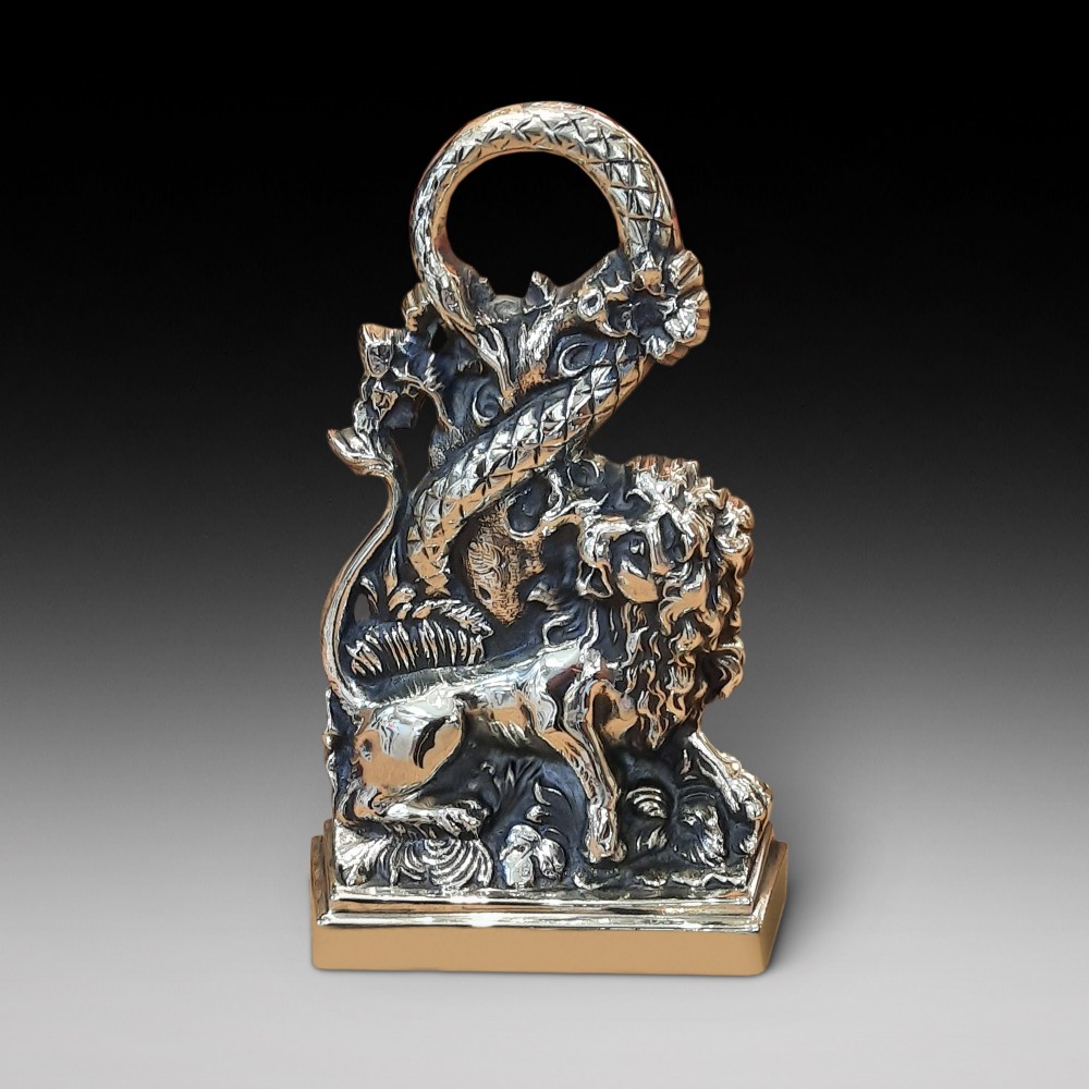 1920’s cast brass door porter depicting a lion and serpent