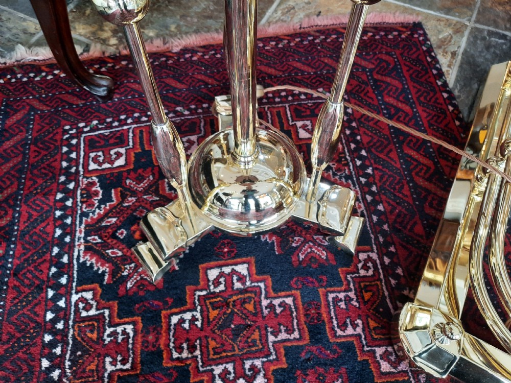 An early 20th-century Art Nouveau brass standard lamp featuring openwork base detailing and a patterned terracotta lampshade with fringe and tassels. View II