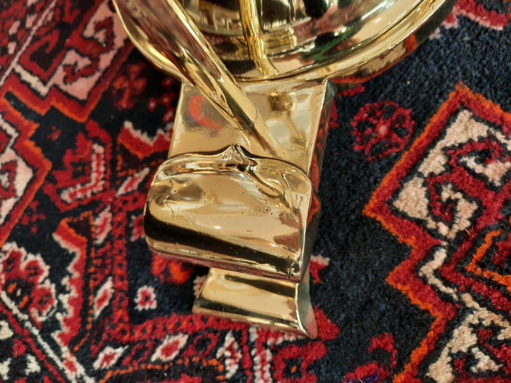 An early 20th-century Art Nouveau brass standard lamp featuring openwork base detailing and a patterned terracotta lampshade with fringe and tassels. View III