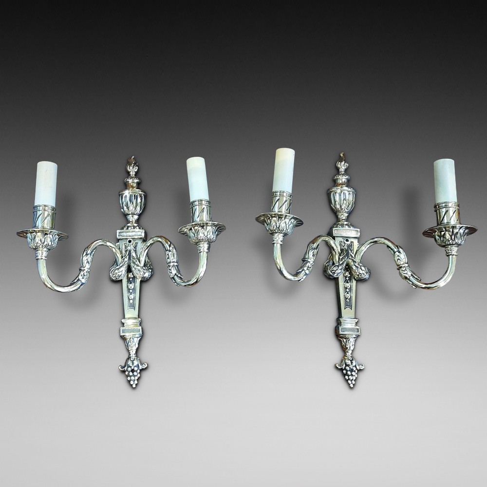 Pair of early 20thC brass twin branch wall lights
