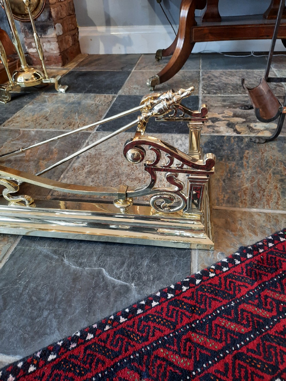 Art Nouveau brass fender and irons View V