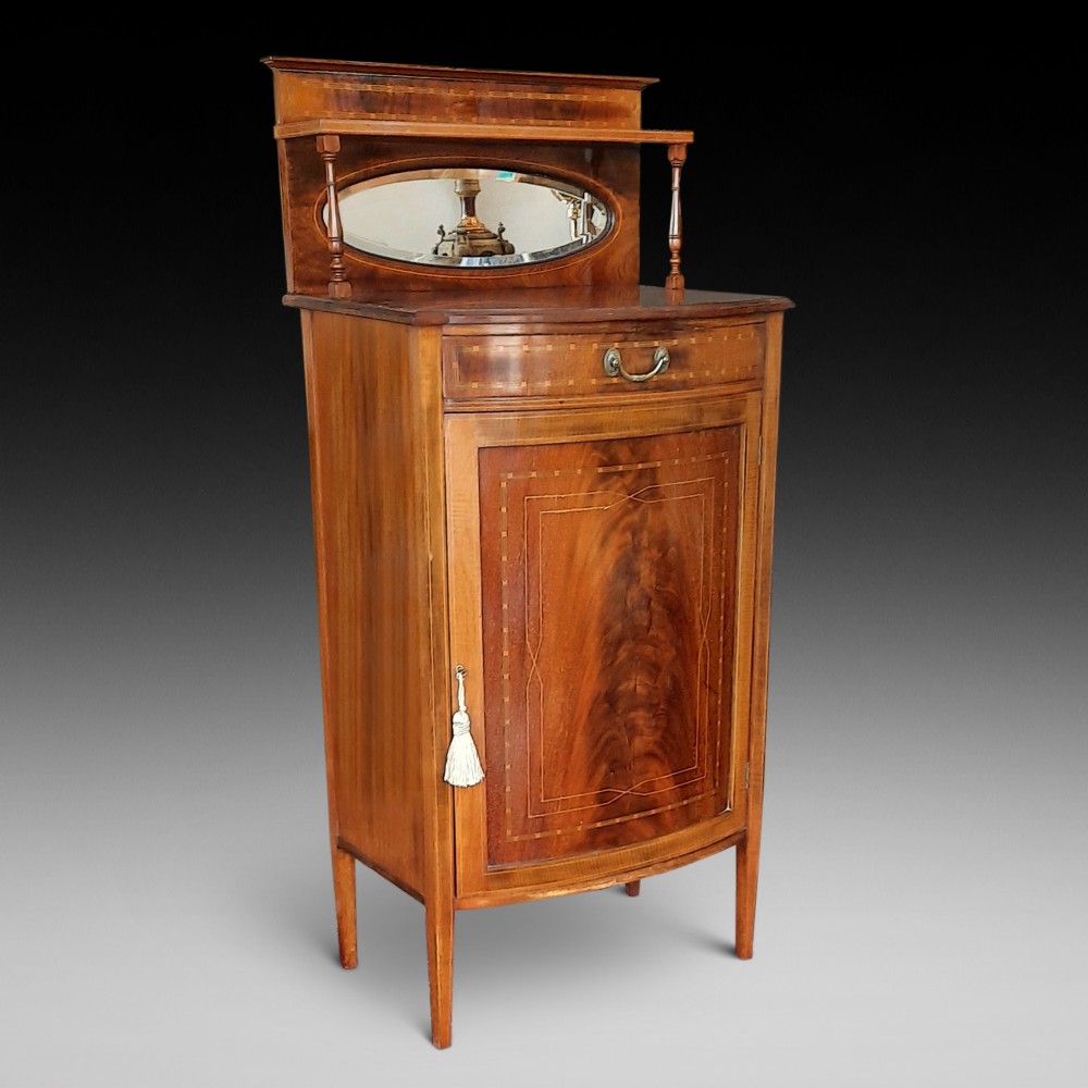 Edwardian mahogany and inlaid bow front music cabinet