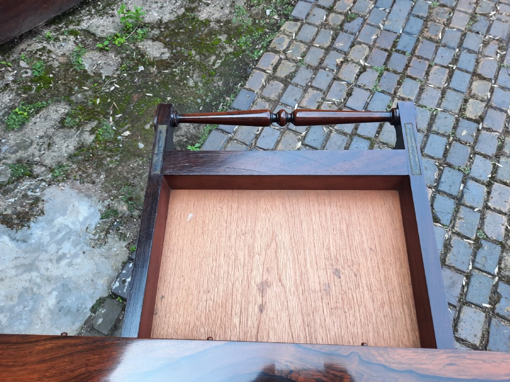 A 19th-century rosewood card table with a fold-over rectangular top, carved scroll apron, turned supports, and carved claw feet. View VII
