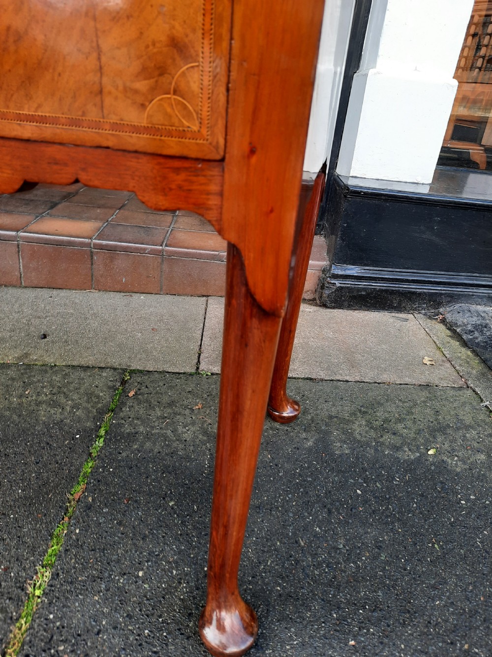 An Edwardian inlaid mahogany lowboy featuring three drawer fronts decorated with lighter wood inlay, an arched apron, and cabriole legs. View II