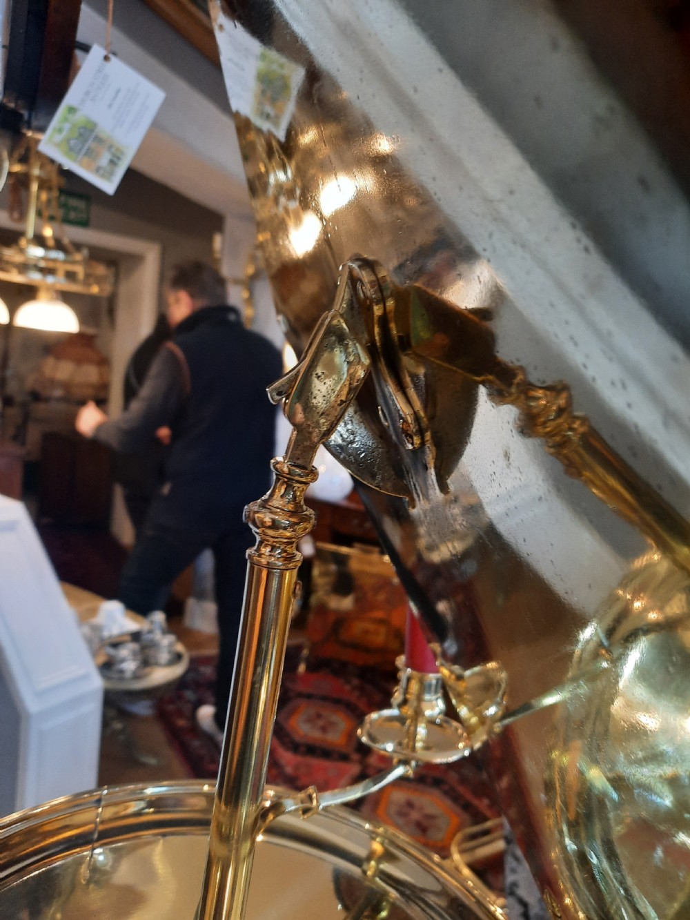 A nineteenth-century brass telescopic shaving stand featuring a diamond-shaped mirror, two candle sconces, a small circular tray, and a tripod base. View V