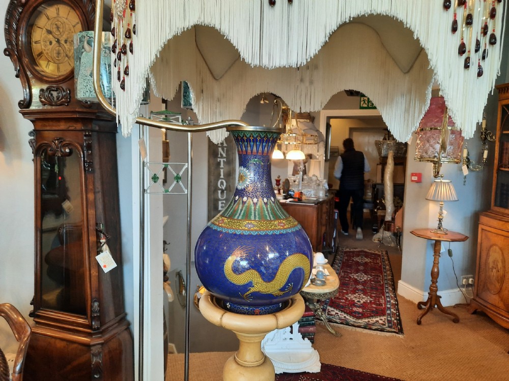 A 1920s painted cream wooden standard lamp featuring a central blue decorated ceramic vase, a gooseneck brass arm, and a fabric lampshade with beaded fringe. View III