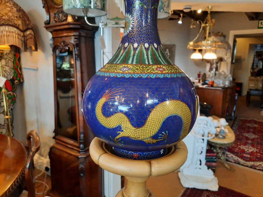 A 1920s painted cream wooden standard lamp featuring a central blue decorated ceramic vase, a gooseneck brass arm, and a fabric lampshade with beaded fringe. View IV