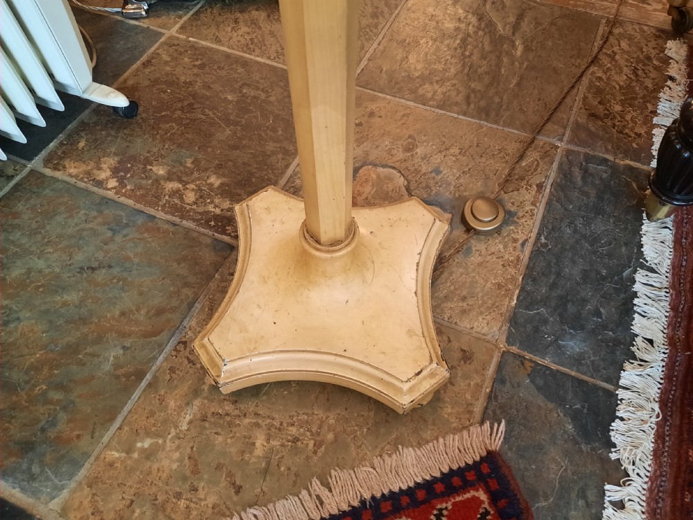 A 1920s painted cream wooden standard lamp featuring a central blue decorated ceramic vase, a gooseneck brass arm, and a fabric lampshade with beaded fringe. View V