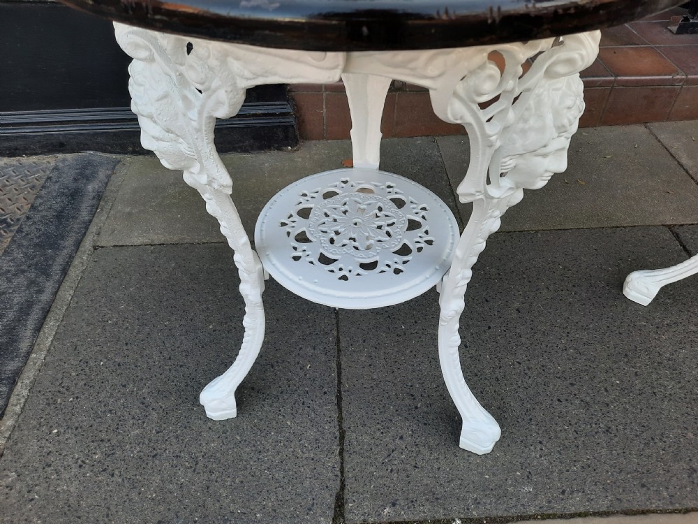 Pair of Late 19th Century Cast Iron Britannia Garden Tables View II