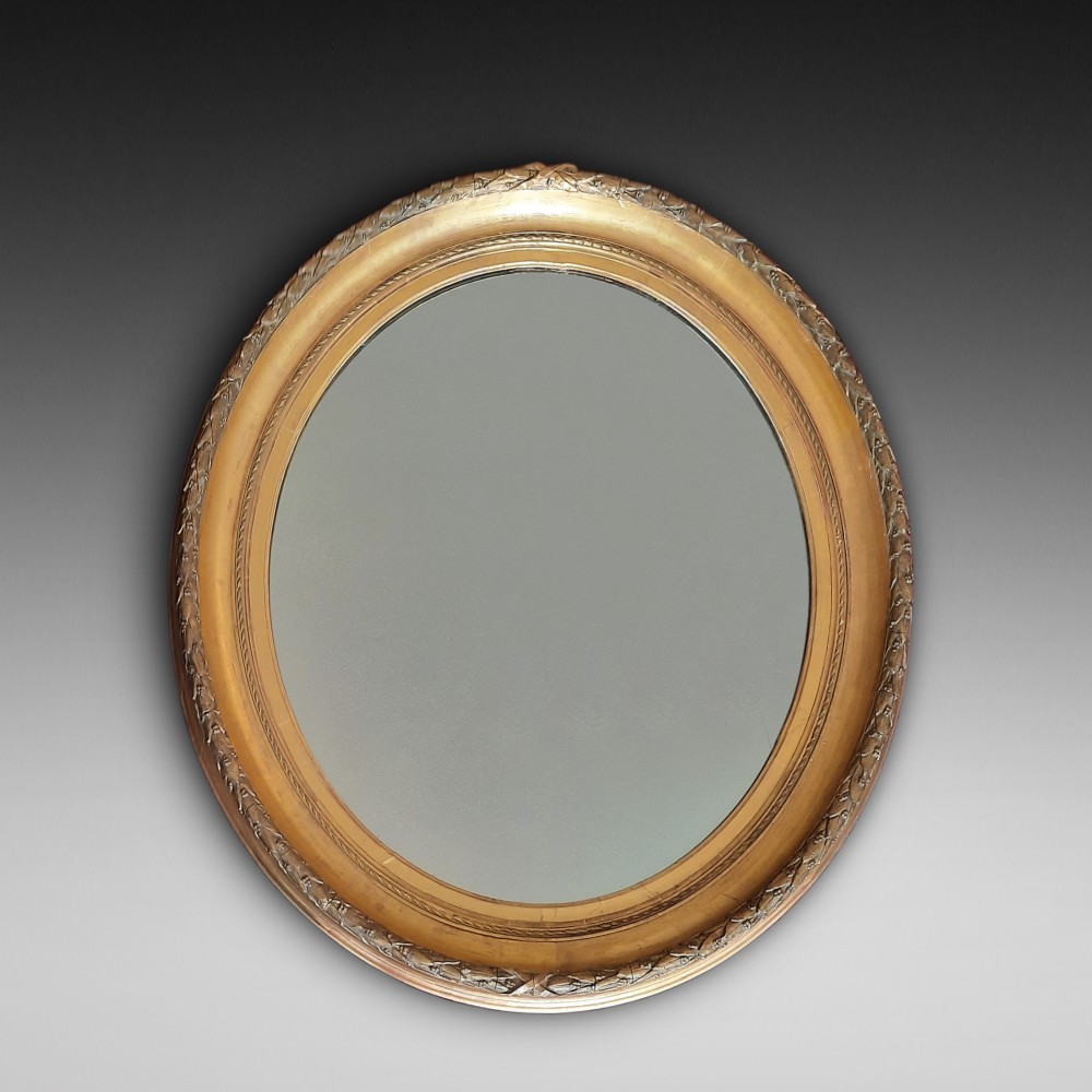 Victorian oval giltwood and gesso wall mirror