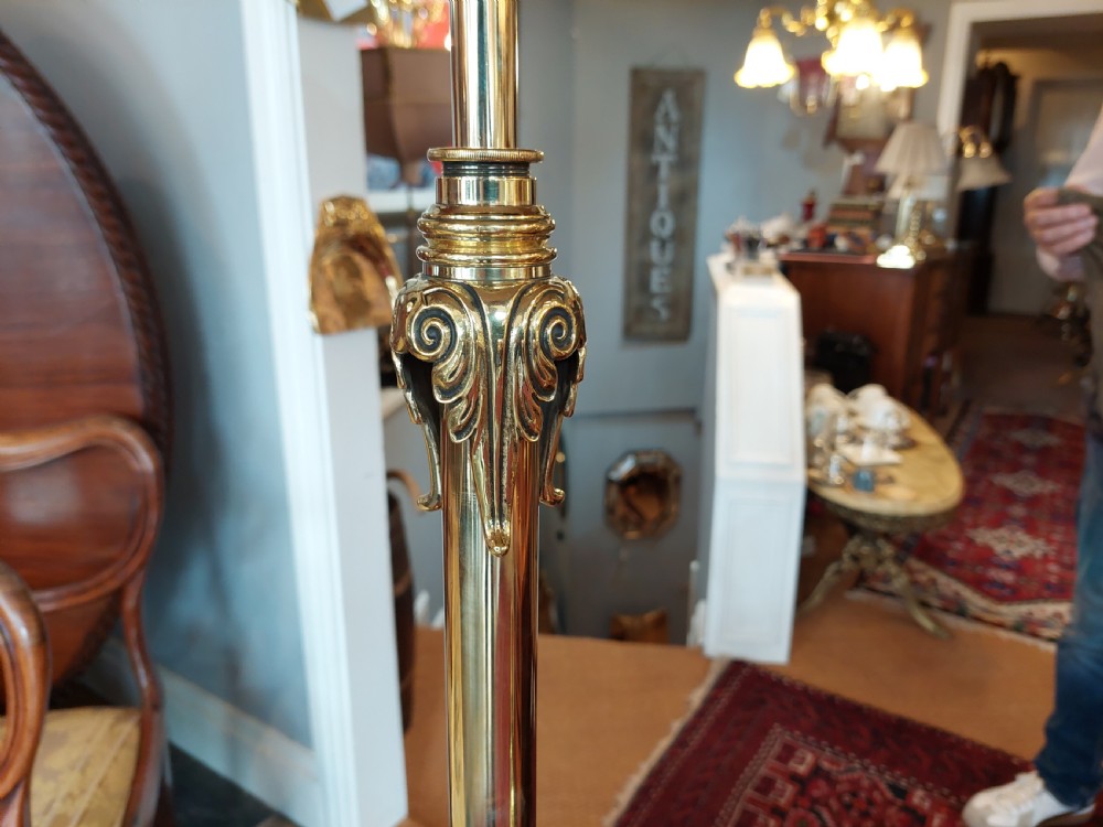 A late Victorian brass and copper extending standard floor lamp featuring a scrolled tripod base and a cream fringed shade. View IV