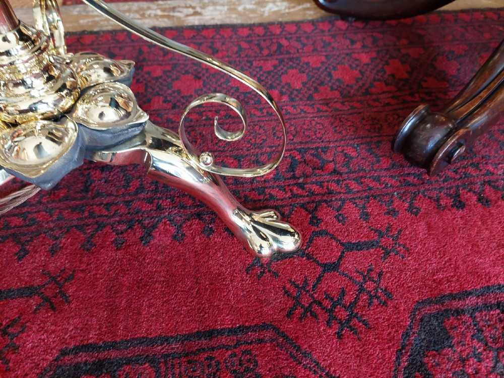 An Art Nouveau brass adjustable standard lamp with a tripod base, telescopic central stem, and a cream fringed fabric shade. View VII
