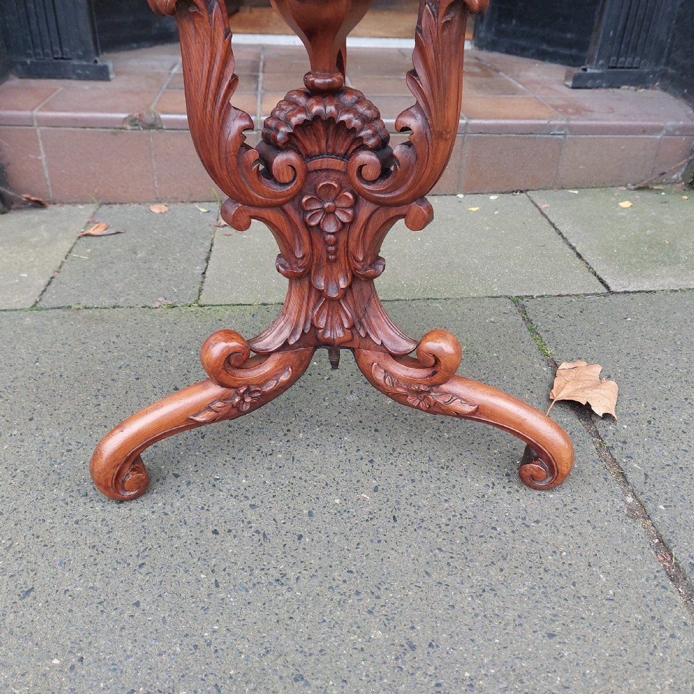 A 19th-century octagonal yew wood work table featuring a hinged top lid, a tapered central body, and carved tripod legs. View IV