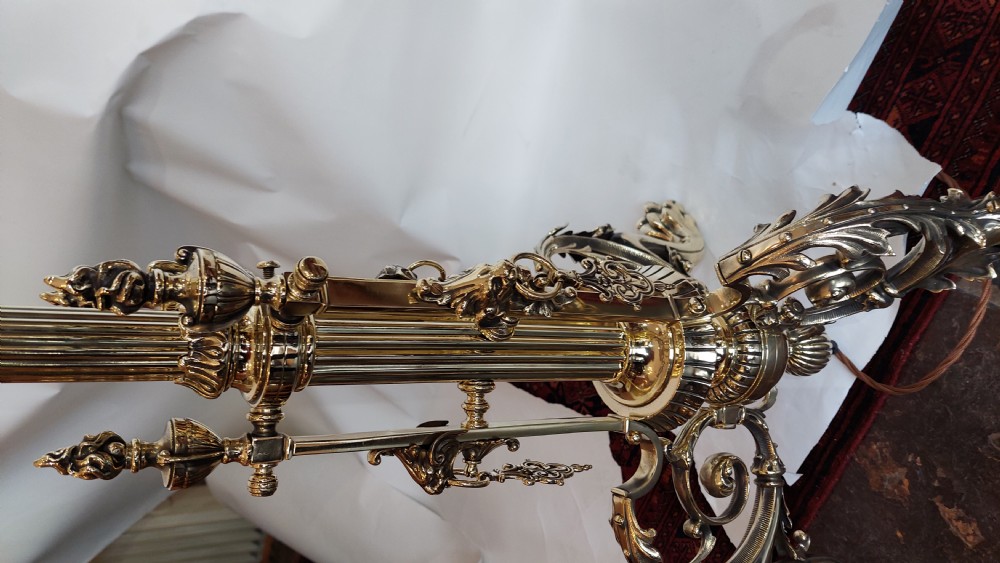 An ornate Victorian brass adjustable standard lamp featuring a scrolled tripod base with paw feet and a fabric shade with fringed tassels. View VIII