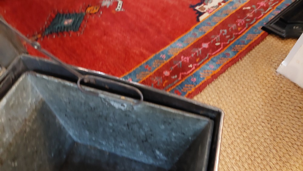 A late 19th-century square copper-plated coal box featuring a hammered finish, hinged lid, drop side handles, and decorative metal studs along the base. View VI