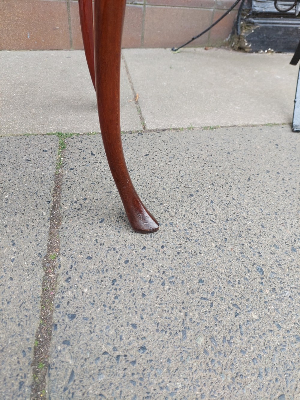 A 19th-century mahogany silver table featuring a raised tray top, shaped apron, and slender cabriole legs. View V