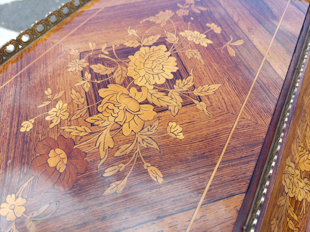 A Victorian kingwood jardiniere table featuring floral marquetry inlays, slender cabriole legs with gilt-metal mounts, and a brass gallery rim. View IV