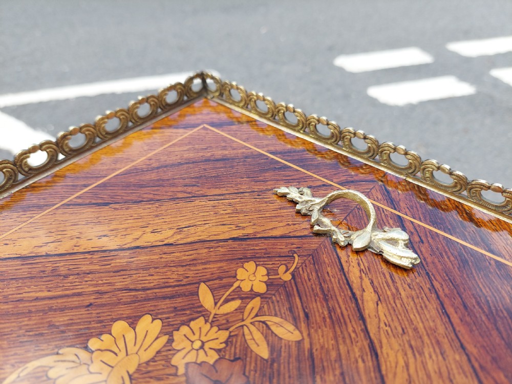 A Victorian kingwood jardiniere table featuring floral marquetry inlays, slender cabriole legs with gilt-metal mounts, and a brass gallery rim. View V