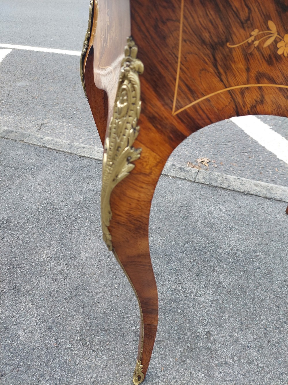 A Victorian kingwood jardiniere table featuring floral marquetry inlays, slender cabriole legs with gilt-metal mounts, and a brass gallery rim. View VIII