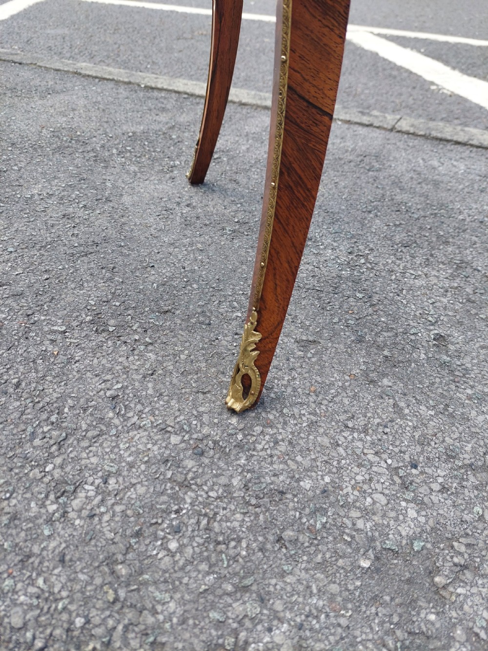 A Victorian kingwood jardiniere table featuring floral marquetry inlays, slender cabriole legs with gilt-metal mounts, and a brass gallery rim. View IX
