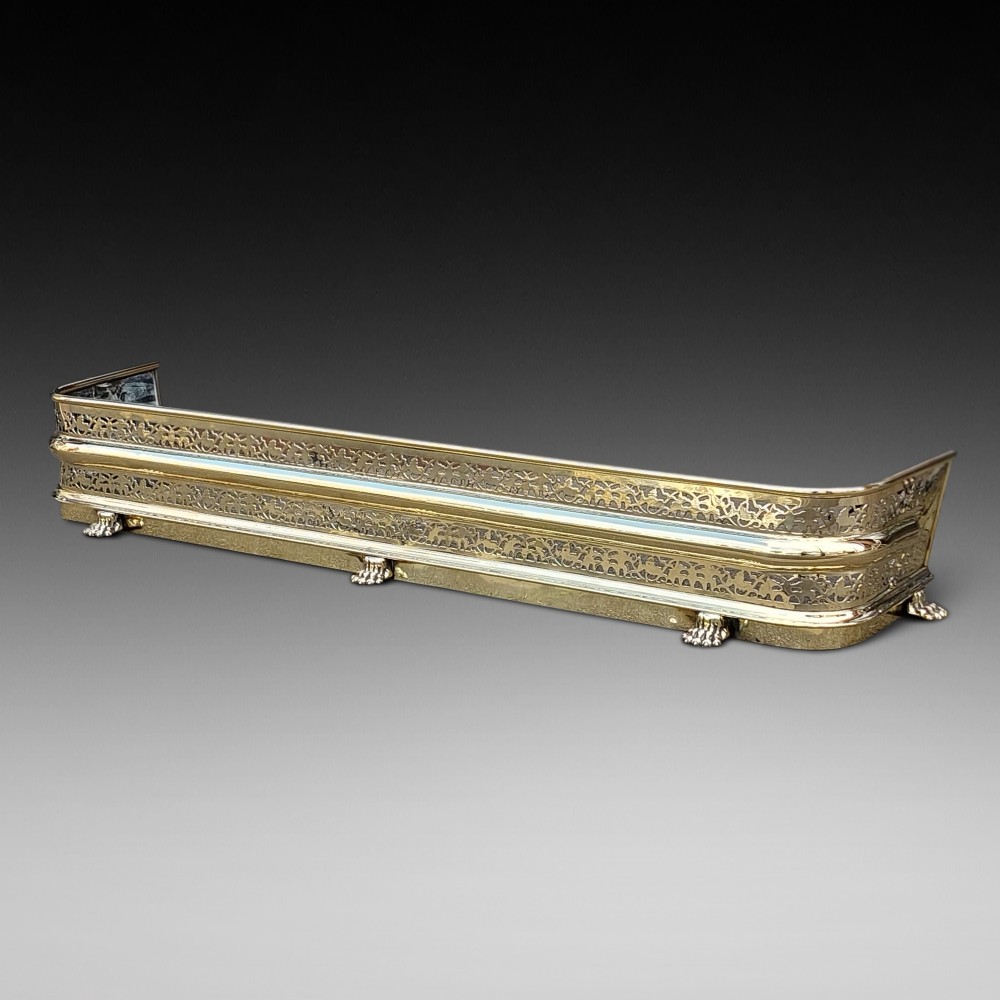 19th century pierced brass fender
