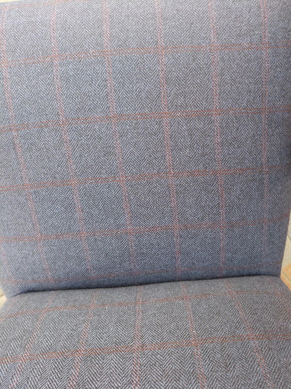 An early twentieth-century Georgian Revival high-backed armchair upholstered in blue fabric with carved walnut legs and eagle head handrests. View IX