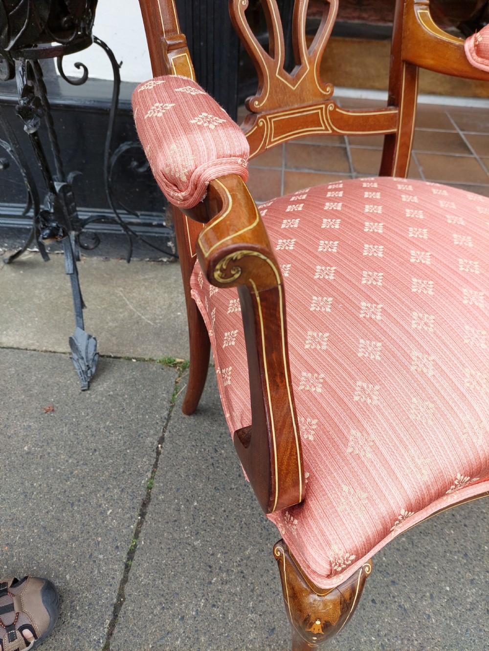 A pair of late Victorian mahogany armchairs featuring inlaid wood detail, padded armrests, and patterned pink fabric upholstery. View IV
