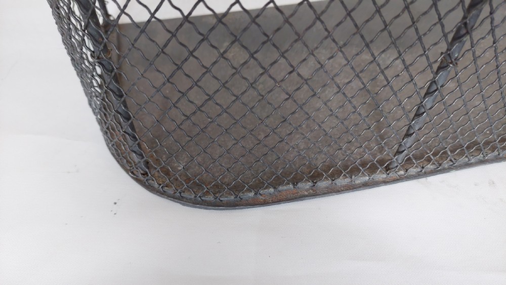 An early nineteenth-century U-shaped nursery fire guard with a polished brass top rail and a woven dark wire mesh body. View V