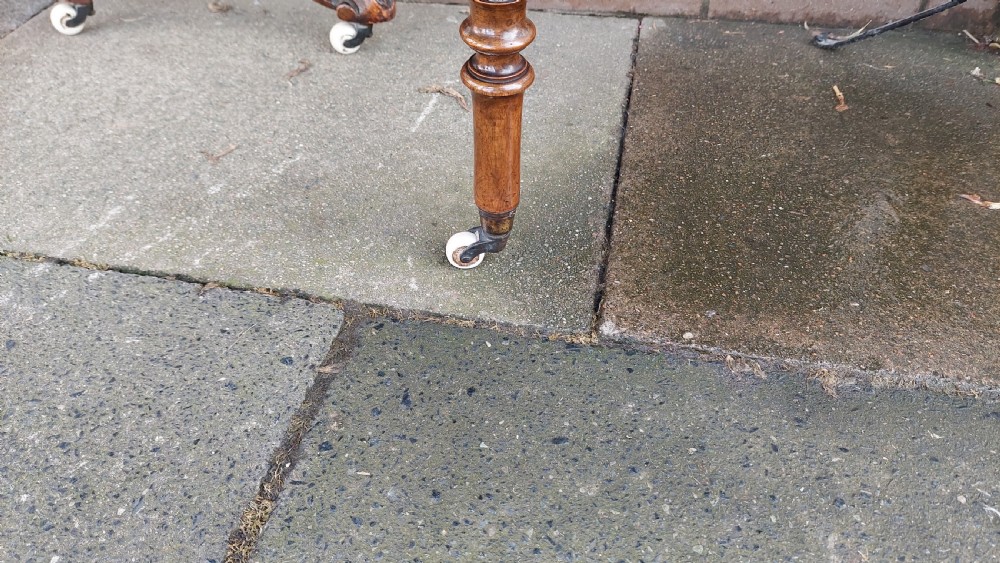 A Victorian burr walnut Sutherland table featuring floral marquetry inlay, twin turned column supports, and carved splayed legs fitted with ceramic castors. View XI