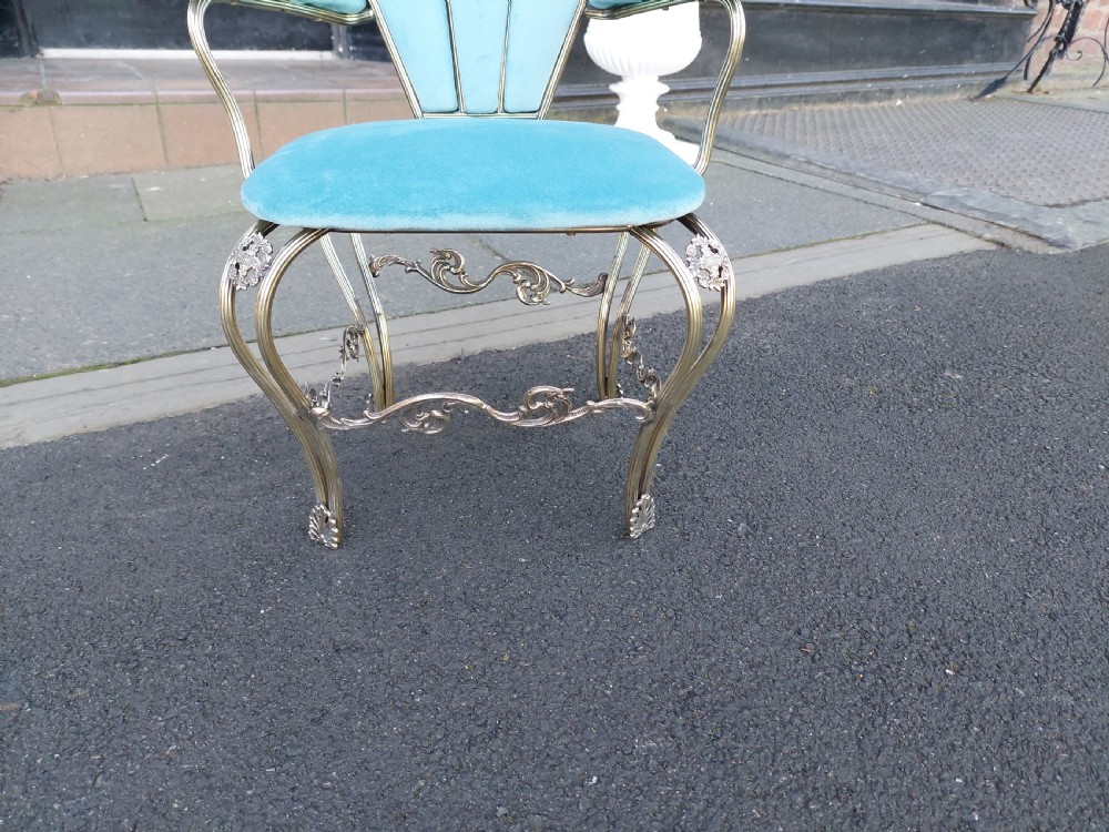 A 1920s miniature metal-framed armchair with turquoise blue velvet upholstery and a fan-shaped backrest. View IV