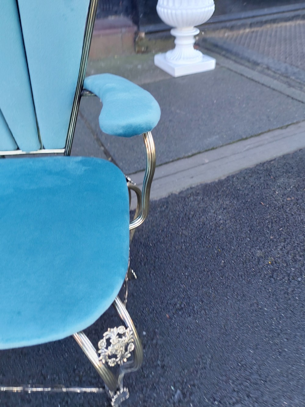 A 1920s miniature metal-framed armchair with turquoise blue velvet upholstery and a fan-shaped backrest. View VII