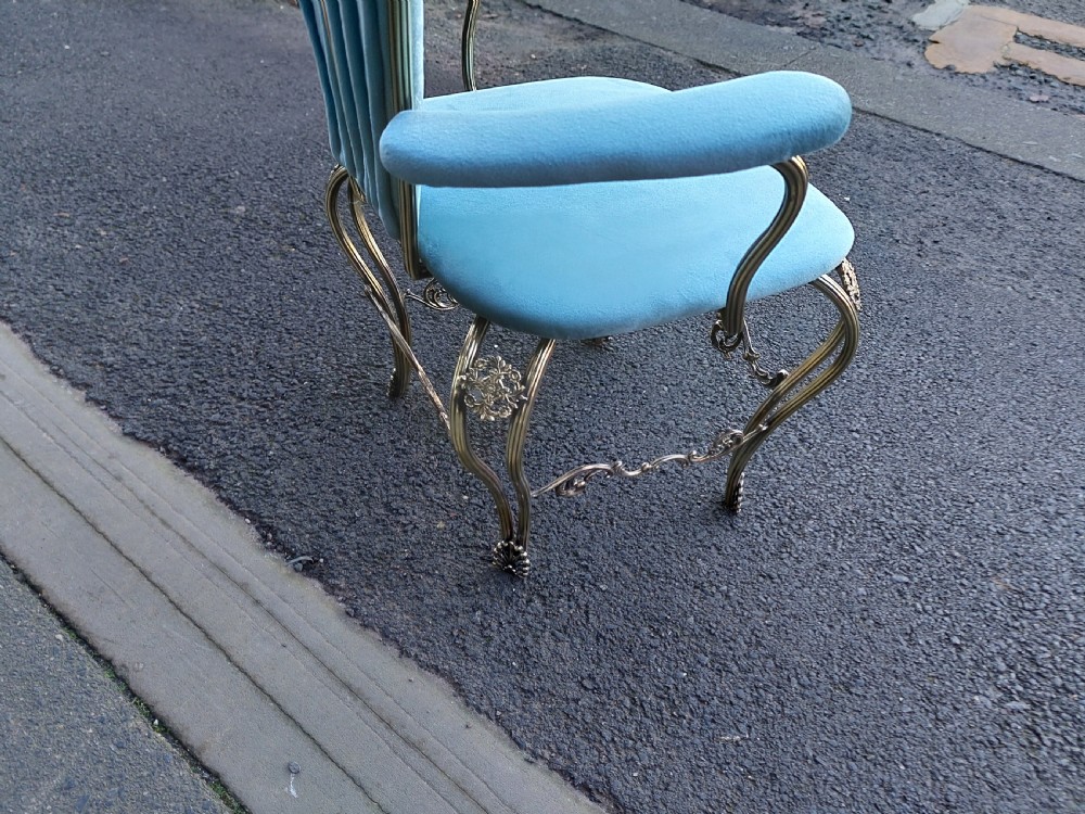 A 1920s miniature metal-framed armchair with turquoise blue velvet upholstery and a fan-shaped backrest. View VIII
