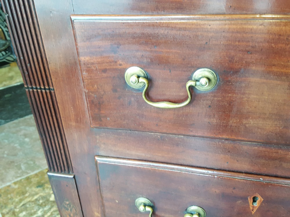A George III mahogany Lancashire mule chest with brass swan-neck handles, fluted quarter columns, diamond keyhole inlays, and ogee bracket feet. View III