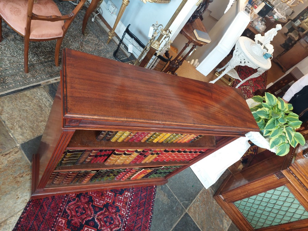 A late 19th-century mahogany dwarf open bookcase with a reeded top frieze, fluted side pilasters, and three fixed shelves. View VI