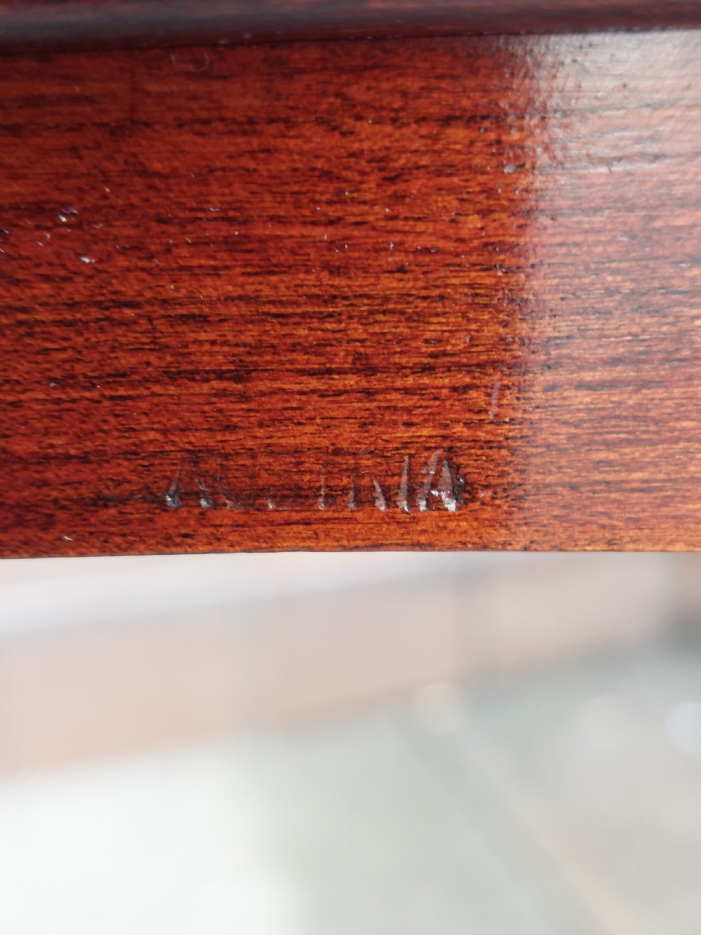 An early twentieth-century mahogany gentlemans vanity table featuring a hinged top mirror and side compartments displaying glass bottles and grooming accessories. View VII