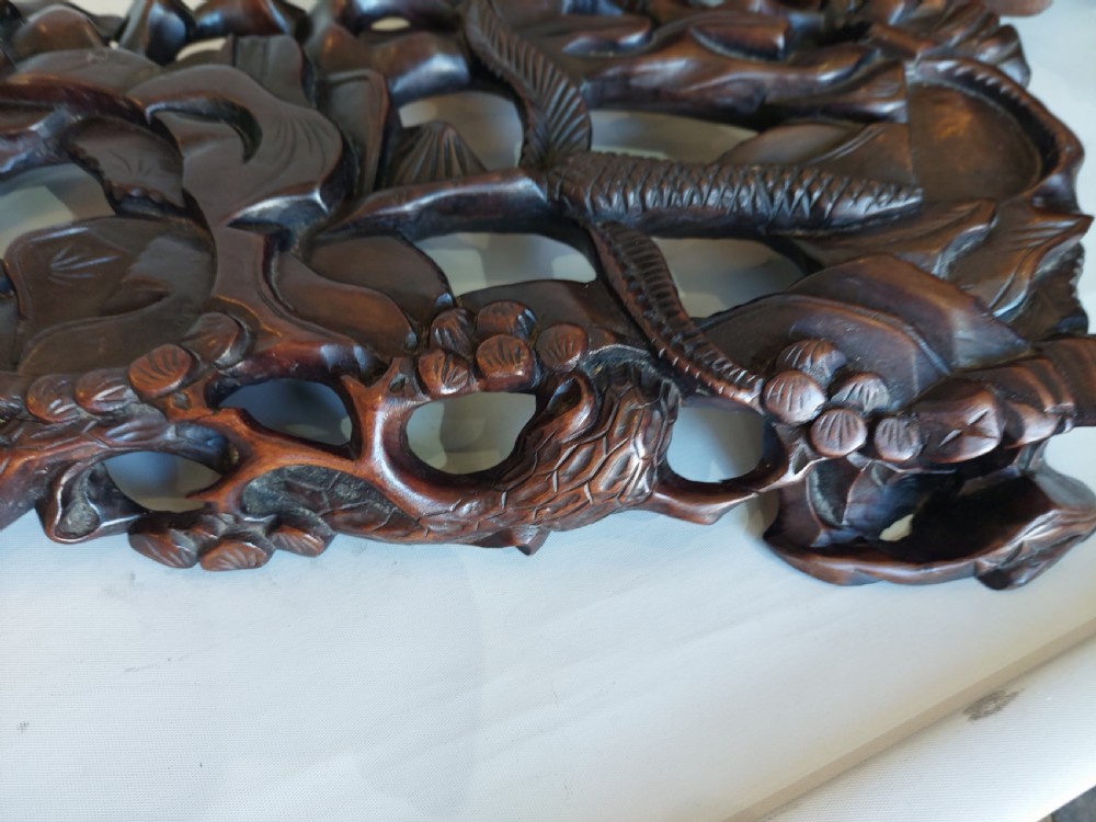 A 19th-century Chinese carved root wood sculpture depicting two boys riding a reclining water buffalo set upon a carved pierced base. View IX