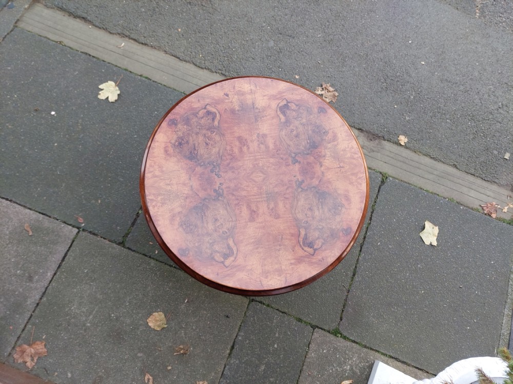 A circular 1920s burr walnut coffee table featuring cabriole legs with pad feet and a figure-grained veneer top. View IV