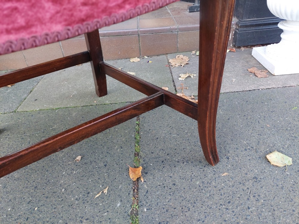 A late 19th-century Hepplewhite style mahogany armchair featuring a carved wheat sheaf oval backrest, curved arms, and a red velvet upholstered seat. View VIII