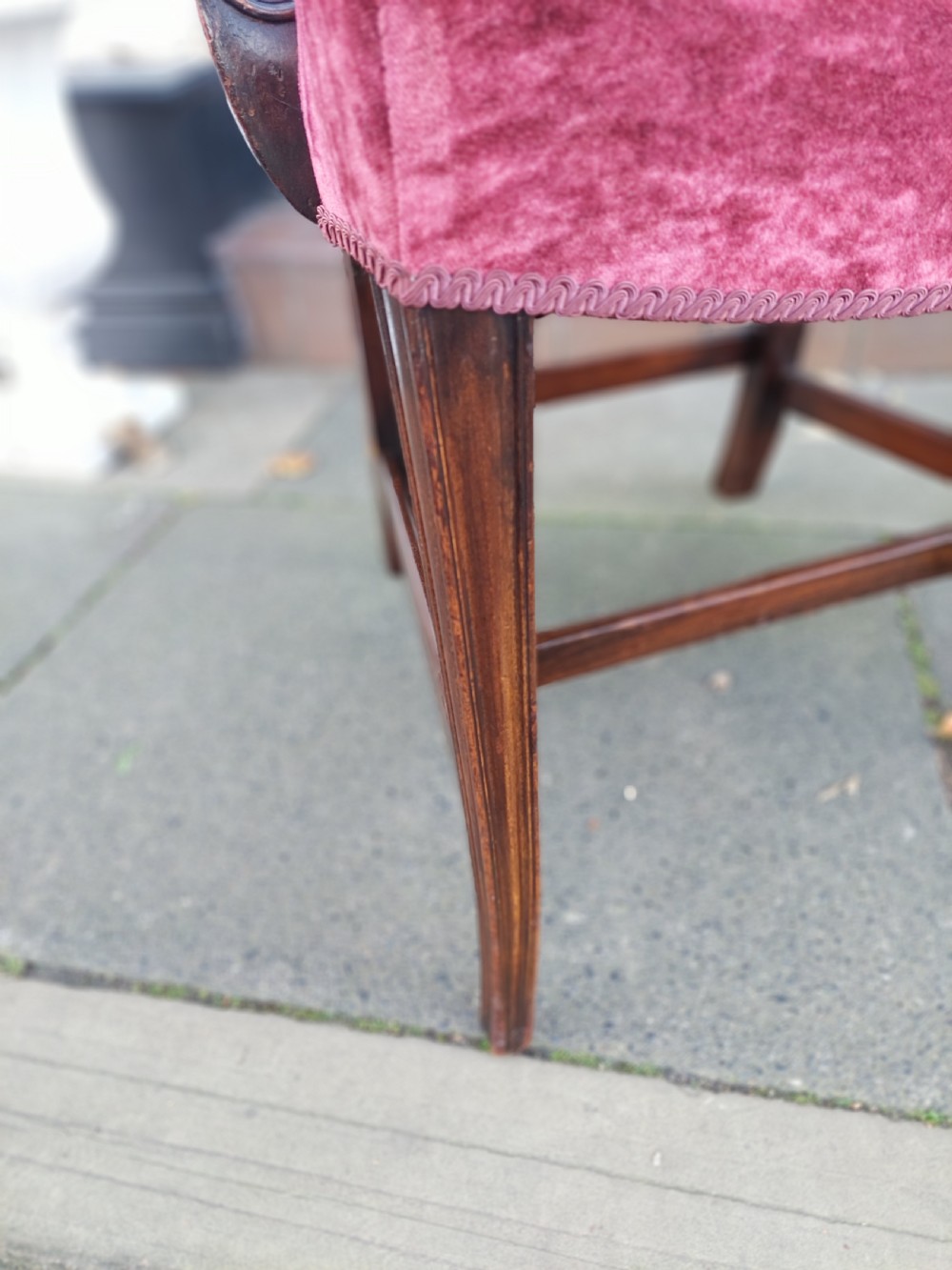 A late 19th-century Hepplewhite style mahogany armchair featuring a carved wheat sheaf oval backrest, curved arms, and a red velvet upholstered seat. View IX